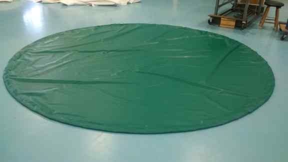 Circular tarp used to cover baseball pitcher's mound