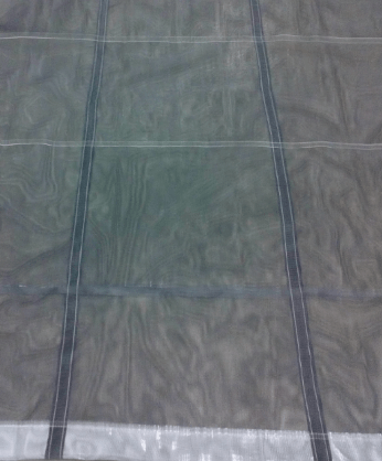 Mesh tarp reinforced with seatbelt material